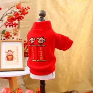 Close-up of festive red pet sweater with traditional Chinese embroidery and lucky patterns