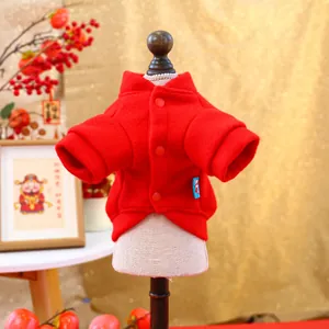 Detail of red festive pet jacket with button closure and warm fleece texture for New Year