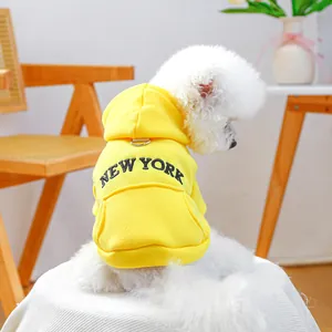 Close-up of yellow dog hoodie with New York embroidery, D-ring and back pocket detail