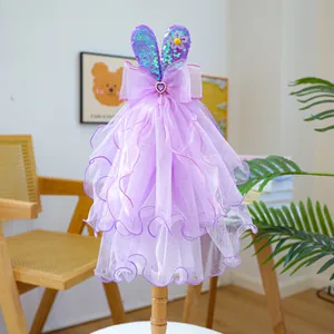 Detail of purple tulle pet dress with bunny ears, sequins and yellow sunflower ornament