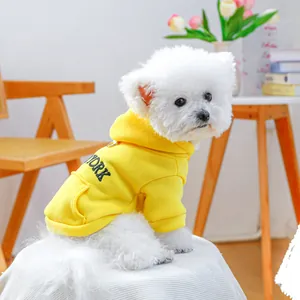 Yellow dog hoodie with New York print and D-ring leash attachment for small dogs
