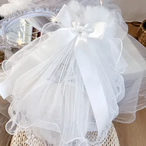 Exquisite white pet wedding veil with satin bow, pearls, and multi-layer mesh detailing