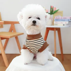 Close-up of a striped dog t-shirt with brown ribbed neckline and soft cotton texture