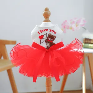 Detail of sequin bear embroidery and red mesh tutu layers on the dog party dress