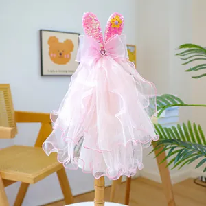 Detail of pink ruffled pet wedding veil with sequined rabbit ears and heart gem