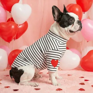 Striped pet t-shirt with red heart patch on a French Bulldog in festive setting