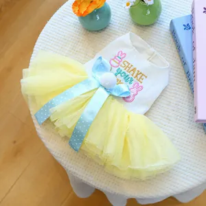 Close-up of pet dress with waffle fabric, rabbit embroidery, and yellow mesh tutu skirt