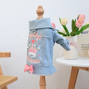 Detail of blue denim pet coat with Daddy's Princess embroidery, pearls and pink bow