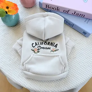 Detail of white fleece pet hoodie with California Dream embroidery and floral design