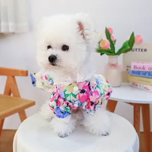 Floral pet dress with lace collar and puff sleeves for small dogs on wooden chair