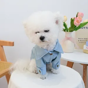 Close-up of a stylish light blue denim pet jacket with metal buttons for small dogs