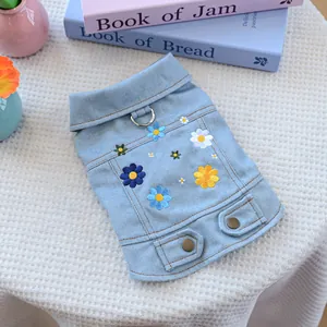 Cute light blue daisy denim dog vest with floral embroidery and a metal D-ring for leash