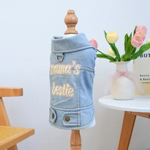 Light blue denim pet vest with 'mama's bestie' embroidery and metallic D-ring