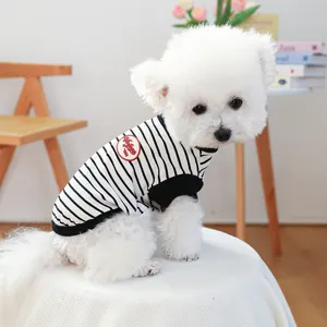 Detail of vintage 1993 patch on black and white striped knit pet vest for small dogs