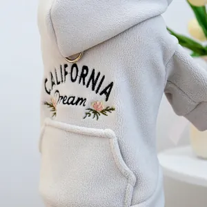 Detail of California Dream embroidery and metal D-ring on fleece dog hoodie