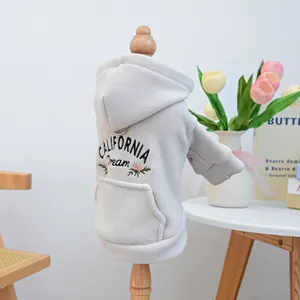 Detail of embroidered California Dream logo and metal D-ring on grey pet hoodie