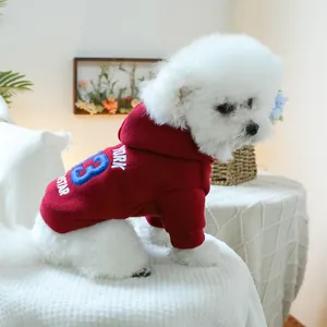 Detail of burgundy dog hoodie with blue York 3 Star embroidery and warm ribbed cuffs