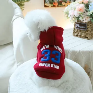 Detail of red pet hoodie featuring retro American embroidery and warm fleece fabric