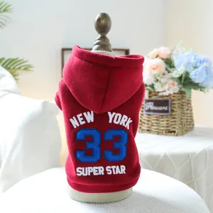 Detail of red pet hoodie with New York 33 embroidery and soft fleece texture
