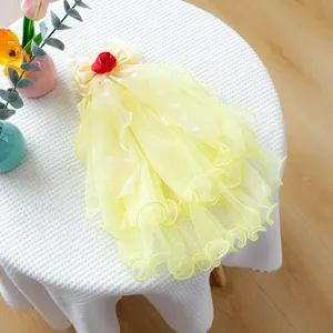 Detail of yellow pet wedding veil with heart mesh, satin bow and red rose flower accent