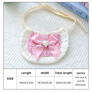 Size chart showing a pink tweed dog bandana with lace edges and a satin heart bow