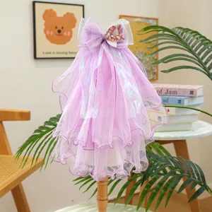 Close-up of a purple multi-layer mesh pet veil with a bow and shell detail
