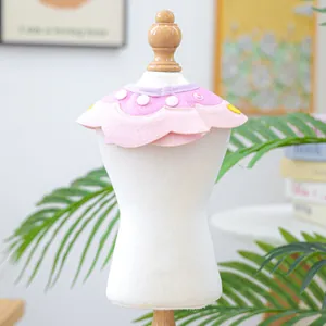 Detail of pink and purple layered petal pet bib with snap button for small dogs and cats