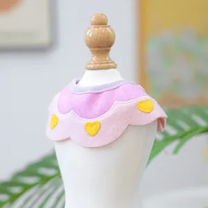 Pink and purple petal-shaped pet bandana with yellow heart embroidery for small dogs