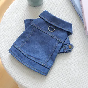 Dark blue denim pet vest with contrast stitching and metal D-ring for leash attachment
