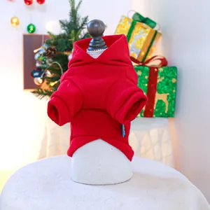 Detail of red Christmas pet hoodie with ribbed cuffs in a festive holiday background