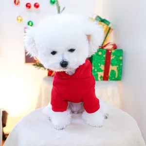 Festive red pet hoodie for dogs shown on a white bichon frise in a Christmas gift setting