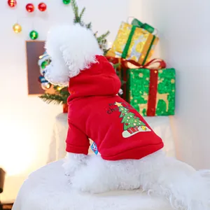 Detail of red Christmas pet hoodie featuring tree print on a small white dog