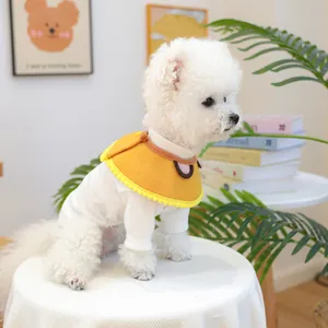 Detail of pet cat dog bib with yellow cartoon ear cape and white ribbed shirt