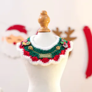 Christmas themed knitted pet bib with candy canes and holly leaves for dogs and cats