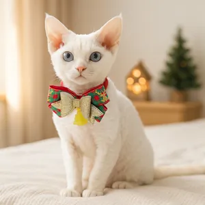 Close-up of a Christmas plaid pet collar with a golden bow and elk motif for cats