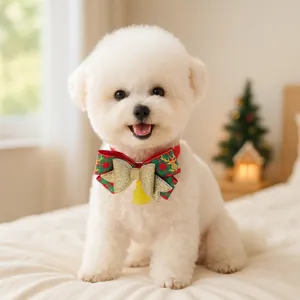 Close-up of a festive red and green plaid dog collar with a gold bow and reindeer pattern