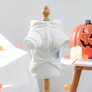 Close-up of a white pet hoodie with soft plush fabric and three front buttons for cats
