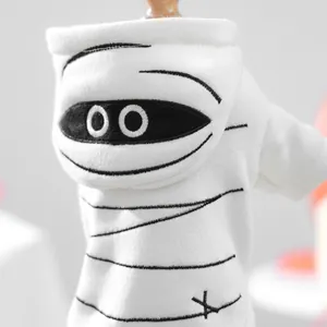 Detail of white mummy costume for dogs and cats with festive Halloween embroidery