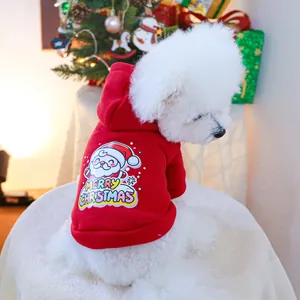 Detail of red Christmas pet hoodie with Santa print and soft fleece fabric on a Bichon