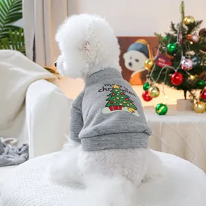 Detail of gray pet Christmas sweatshirt with festive tree print on a small dog