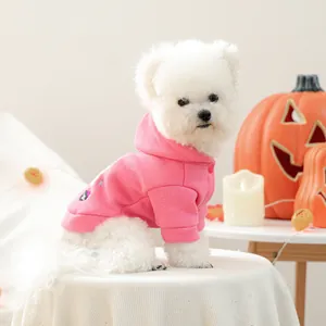 Detail of pink fleece dog hoodie with Kuromi embroidery and matching snap buttons