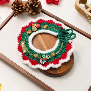 Detail of handmade knit Christmas pet collar with green candy cane and gold chain