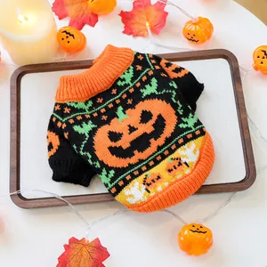 Close-up of a festive Halloween pet sweater with an orange pumpkin knit and ribbed cuffs