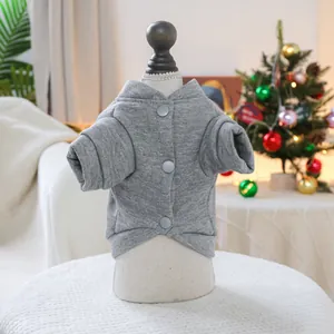 Detail of gray knitted pet vest with buttons and micro collar for autumn winter