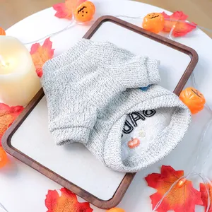Detail of grey knitted pet sweater with DAO embroidery and pumpkin for Halloween