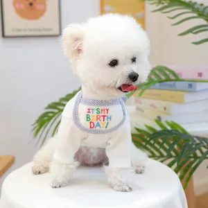 Detail of dog birthday shirt with colorful It's My Birthday embroidery on white rib cotton