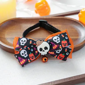 Detail of Halloween pet collar with pumpkin bell and spooky bow on wooden background