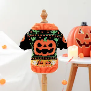 Detail of Halloween pet sweater with orange pumpkin design and festive knit patterns