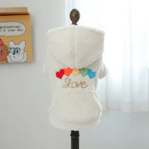 Detail of warm white fleece pet hoodie with colorful heart embroidery and gold Love text