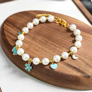Détails du collier pour animaux avec perles blanches et breloques bleu clair